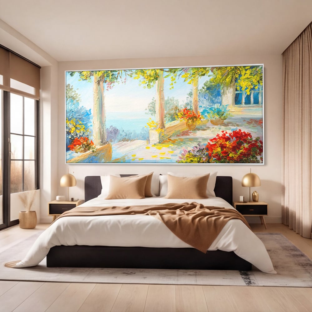 Tablou canvas cu pictura terasa insorita cu flori rosii, in rama de aluminiu argintiu, pe perete intr-un dormitor